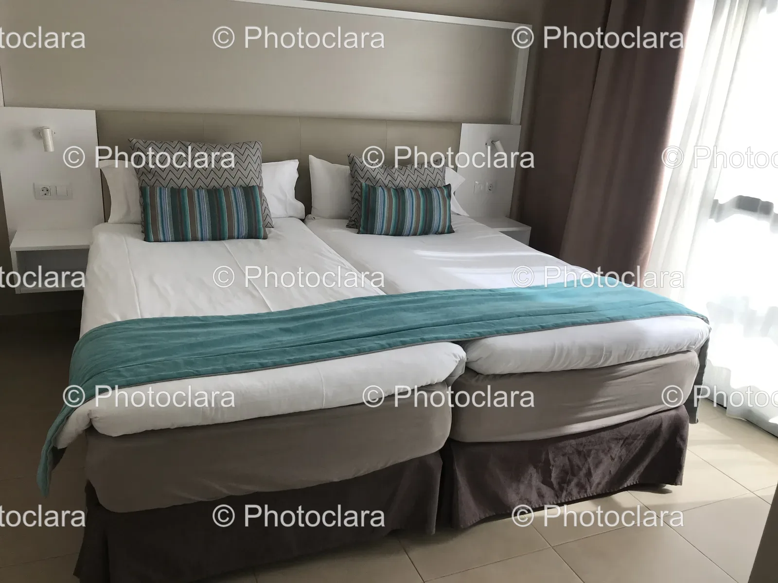 cozy-bed-blue-blanket-pillows-bedroom.jpg