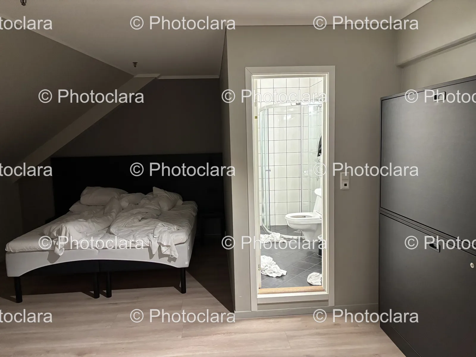 Cozy-Bedroom-with-Bed-and-Refrigerator.jpg