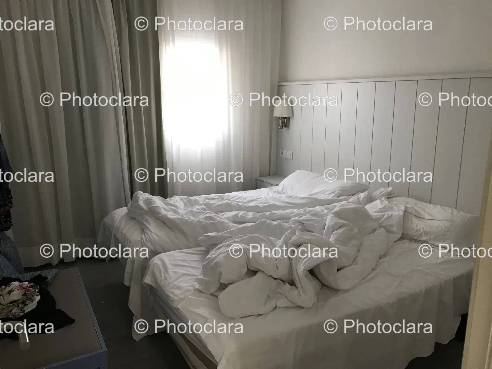 cozy-bedroom-with-white-sheets-and-lamp.jpg