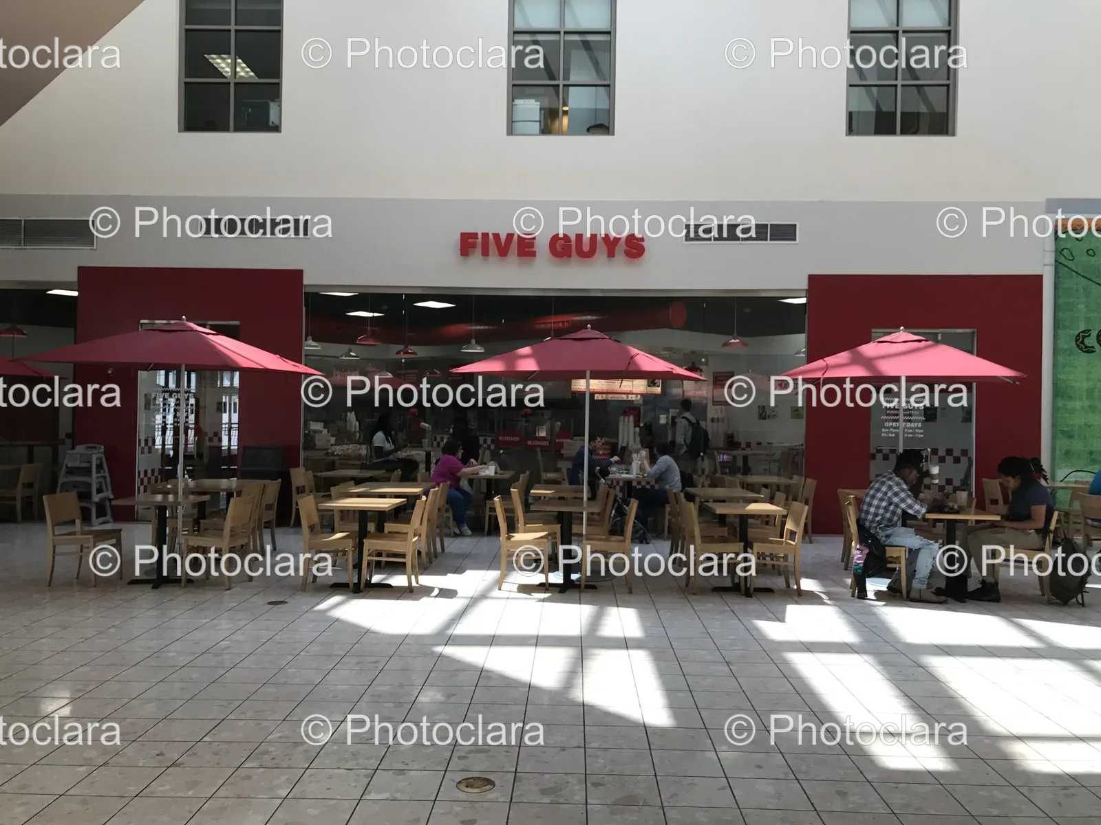 Group-of-People-Dining-at-Five-Guys-Restaurant.jpg