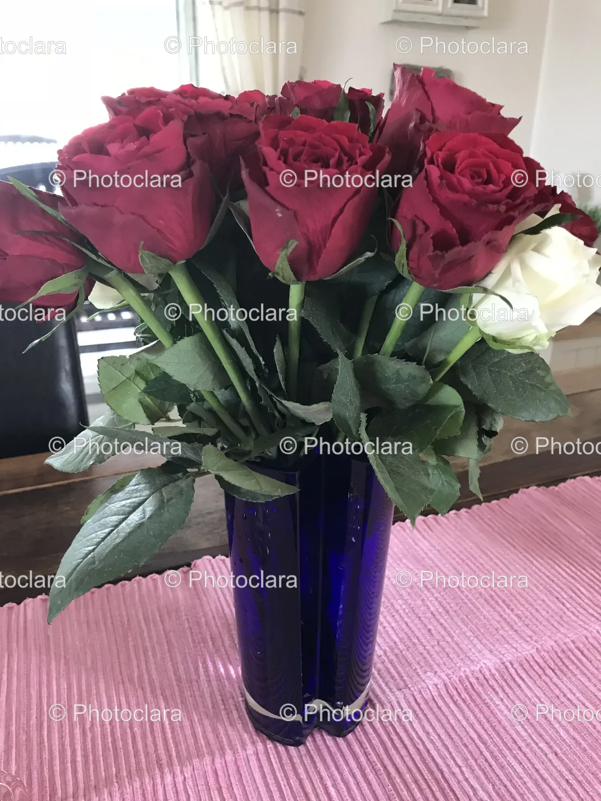 Bouquet-of-Red-and-White-Roses-in-Blue-Vase.jpg