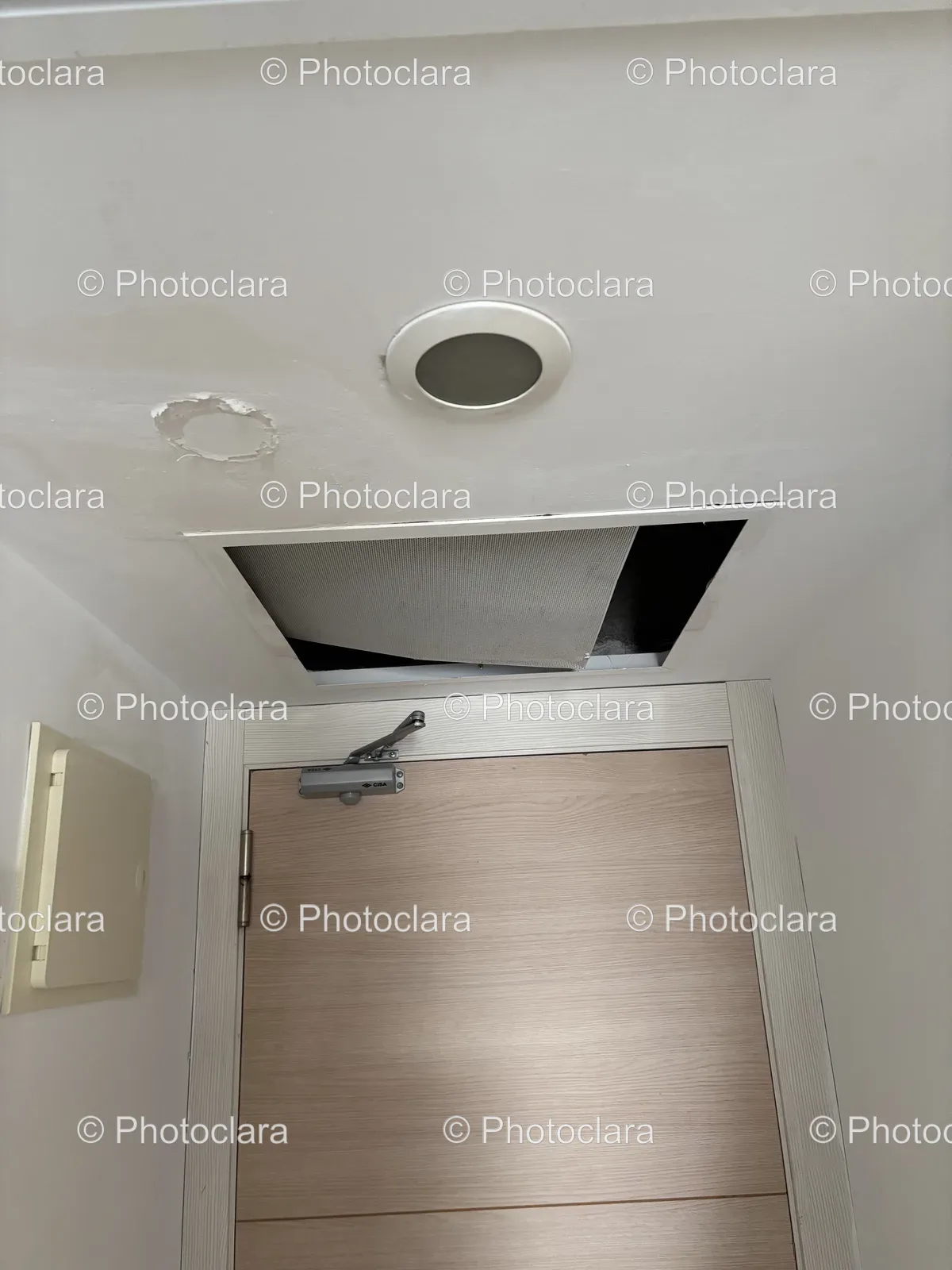 modern-door-with-ceiling-vent-renovated-indoor-space.jpg