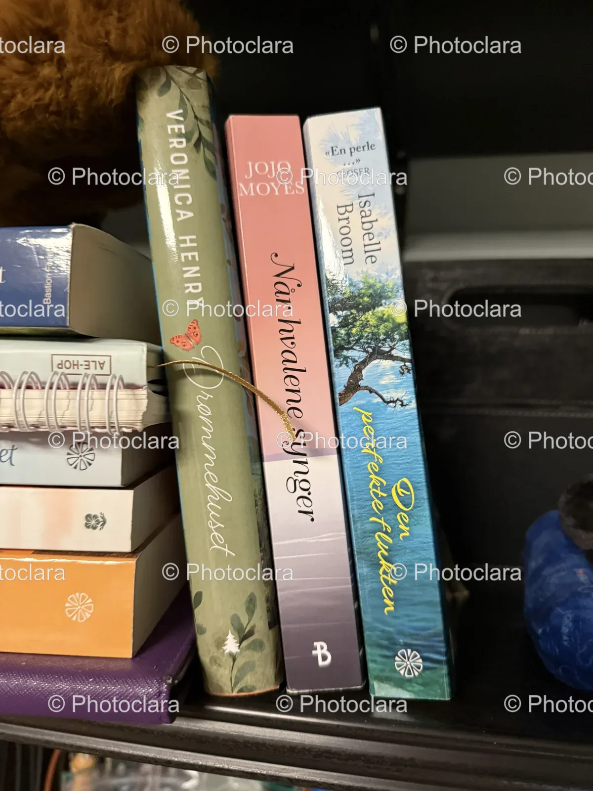 Stack of Books on Shelf by Veronica Henry