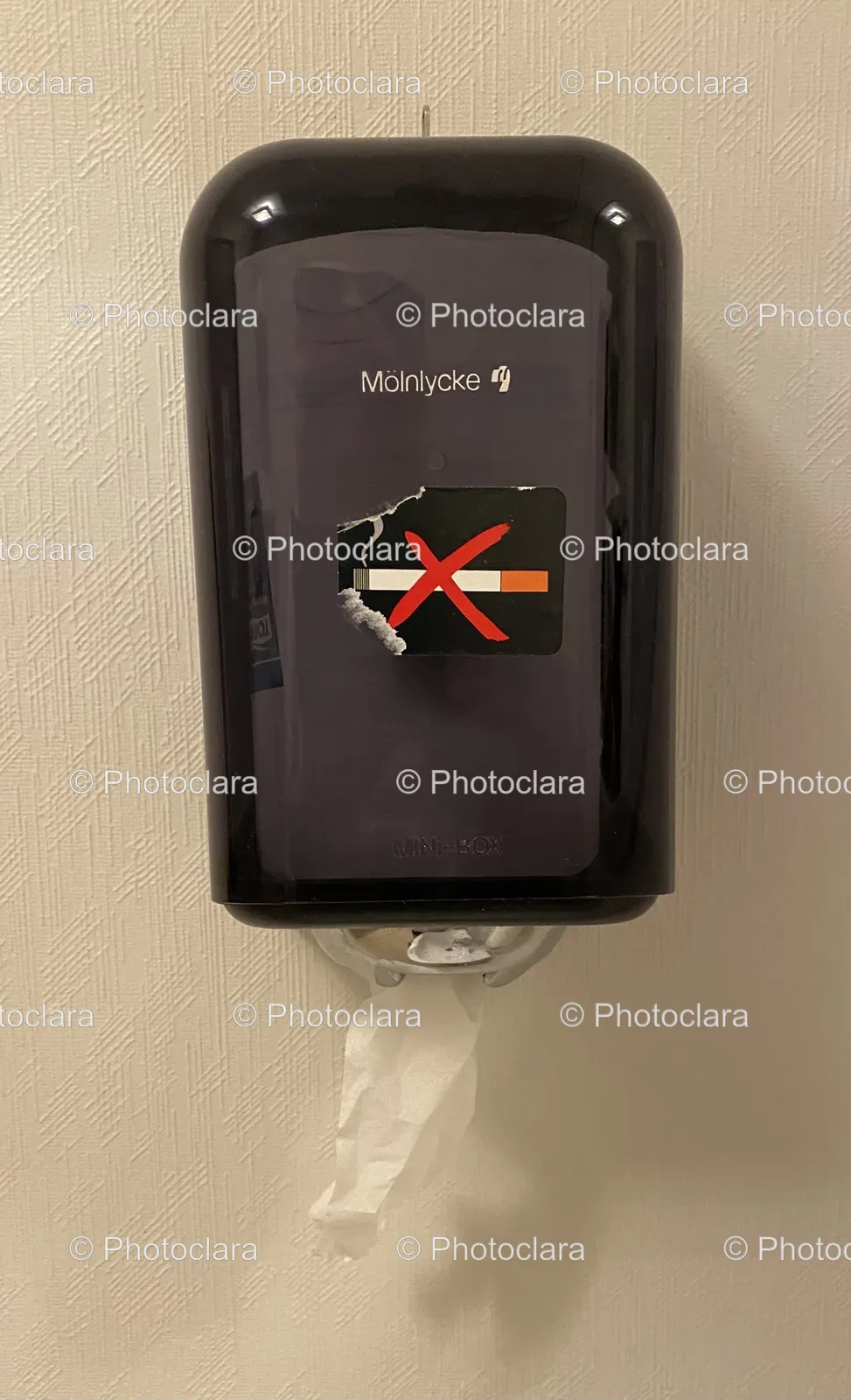 Paper-Towel-Dispenser-With-Cigarette-Sticker.jpg