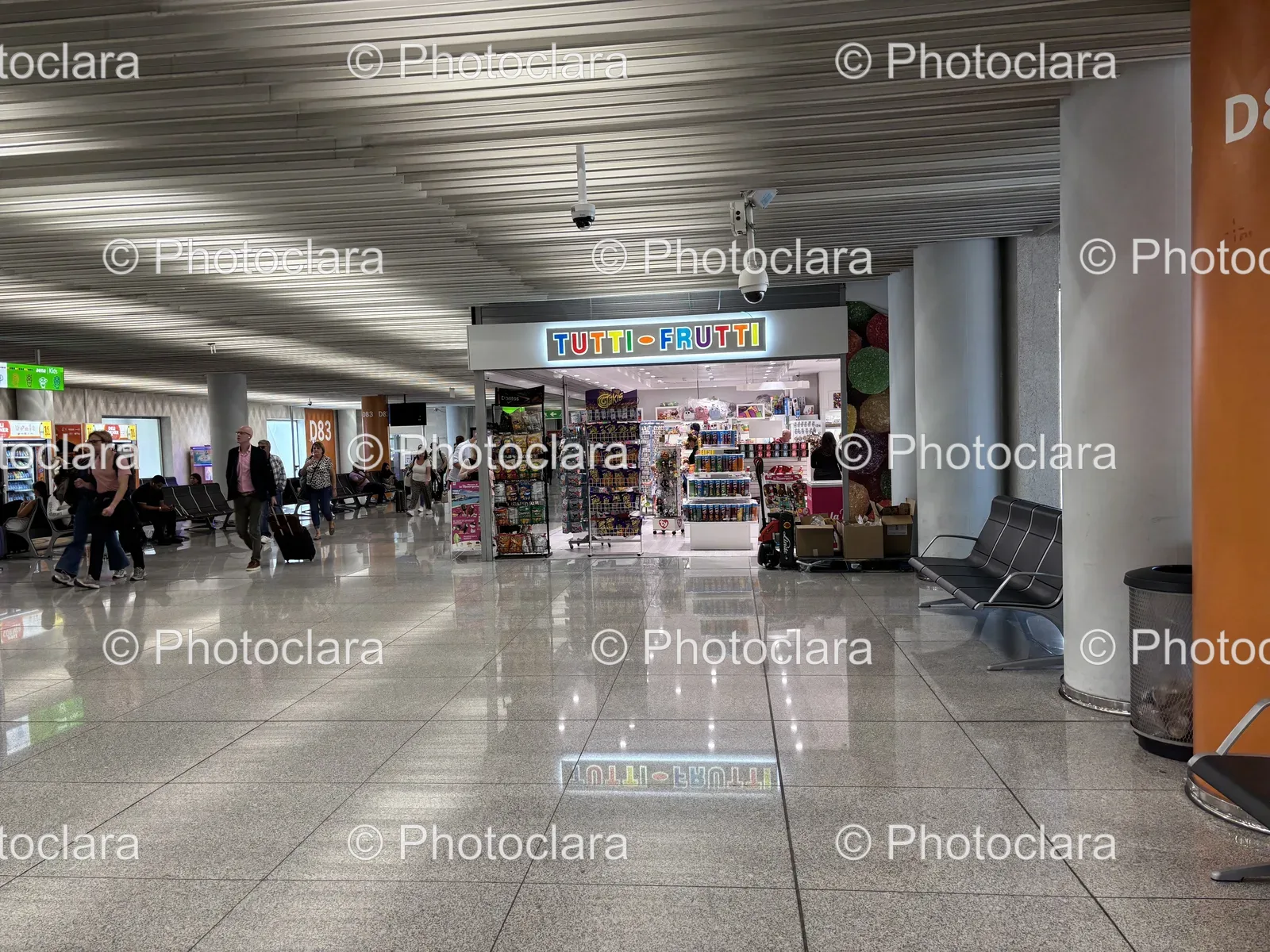 bustling-shopping-mall-with-stores-and-pedestrians.jpg