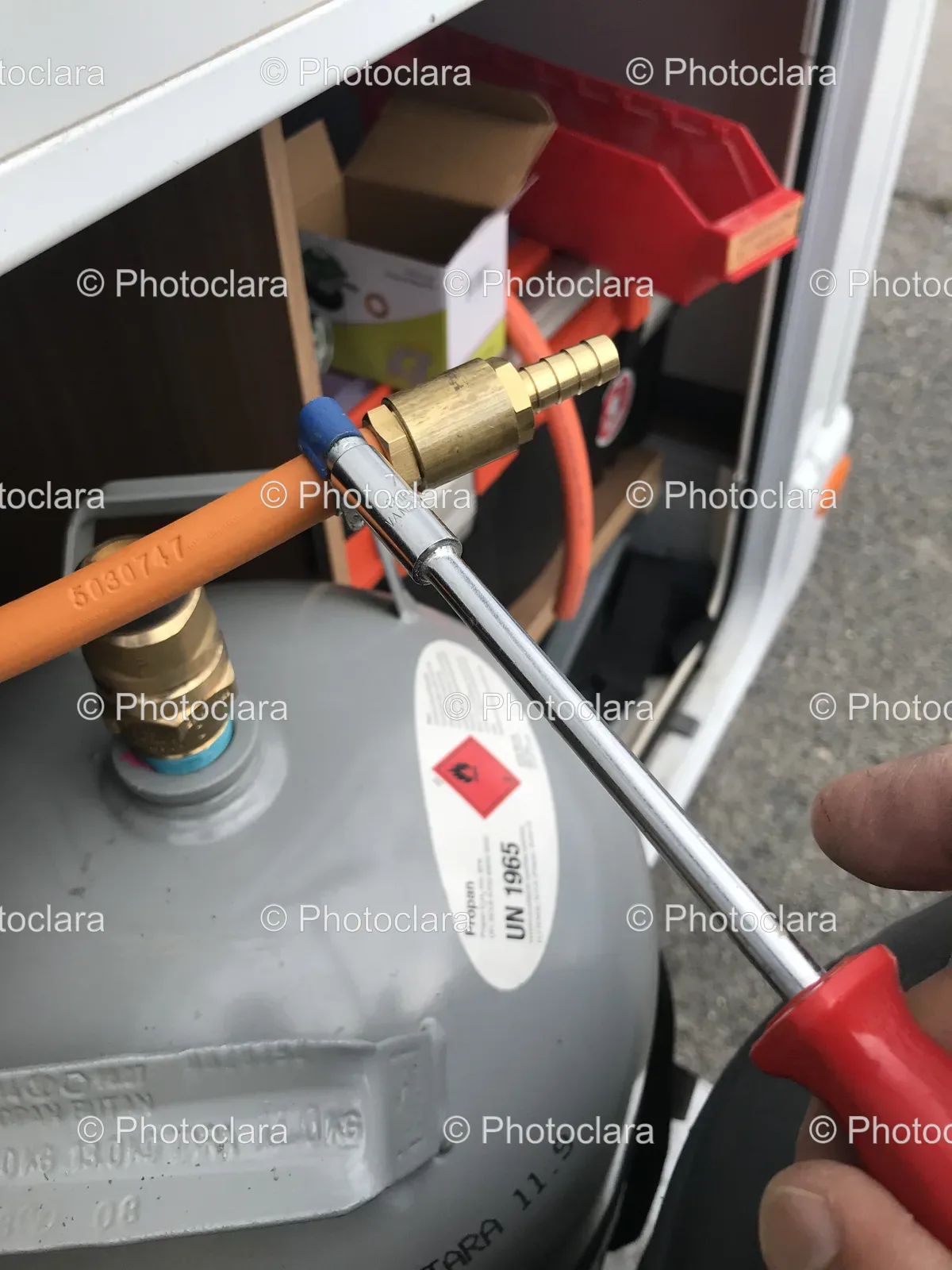 Hand-with-Tool-Adjusting-Gas-Cylinder.jpg