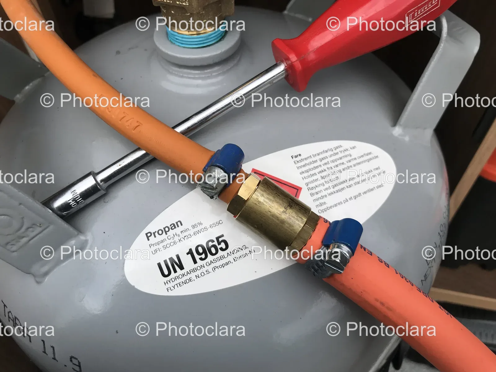 Propane-Gas-Cylinder-with-Screwdriver-and-Hose.jpg