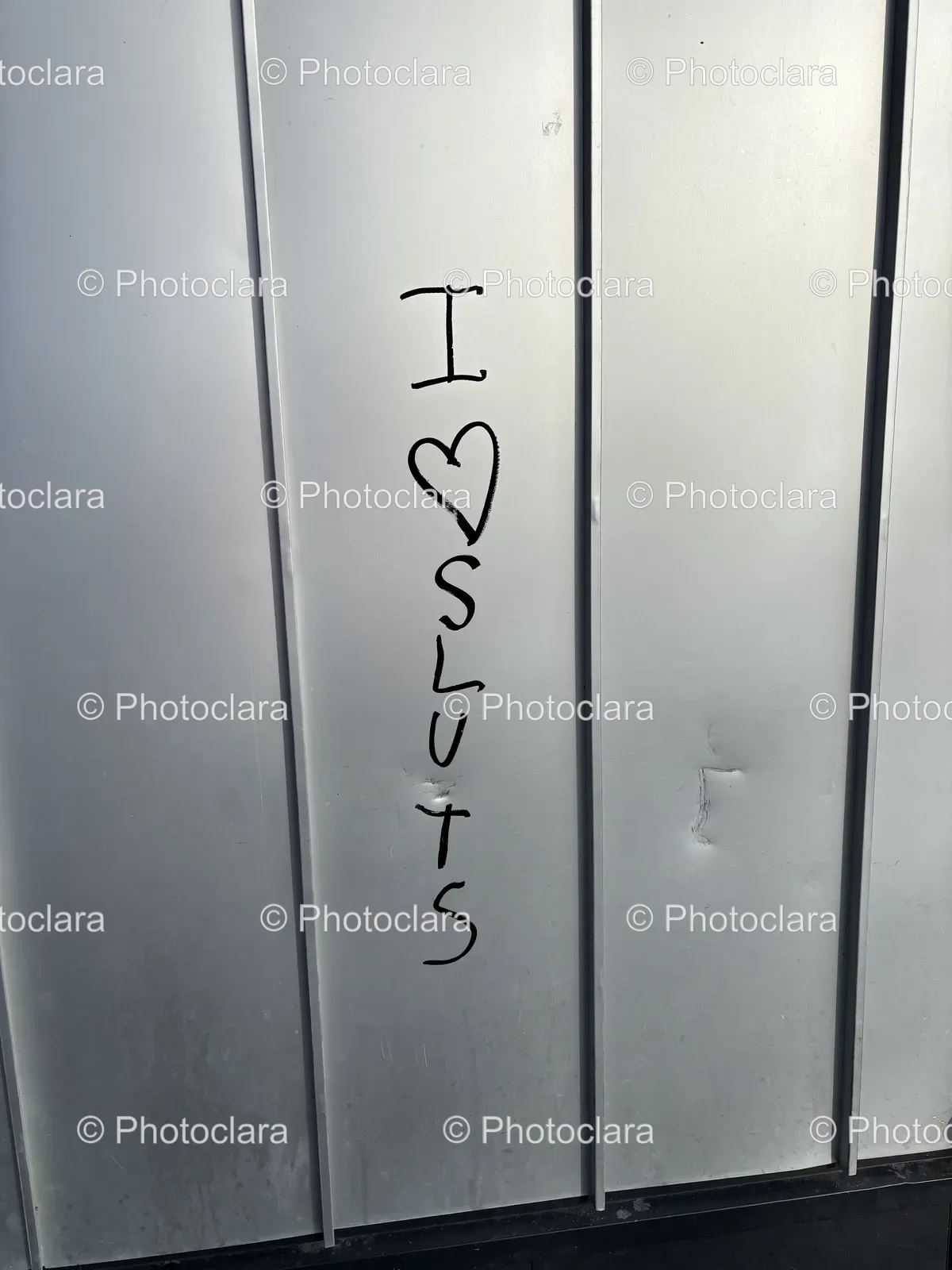 close-up-textured-metal-wall-industrial-handwriting.jpg