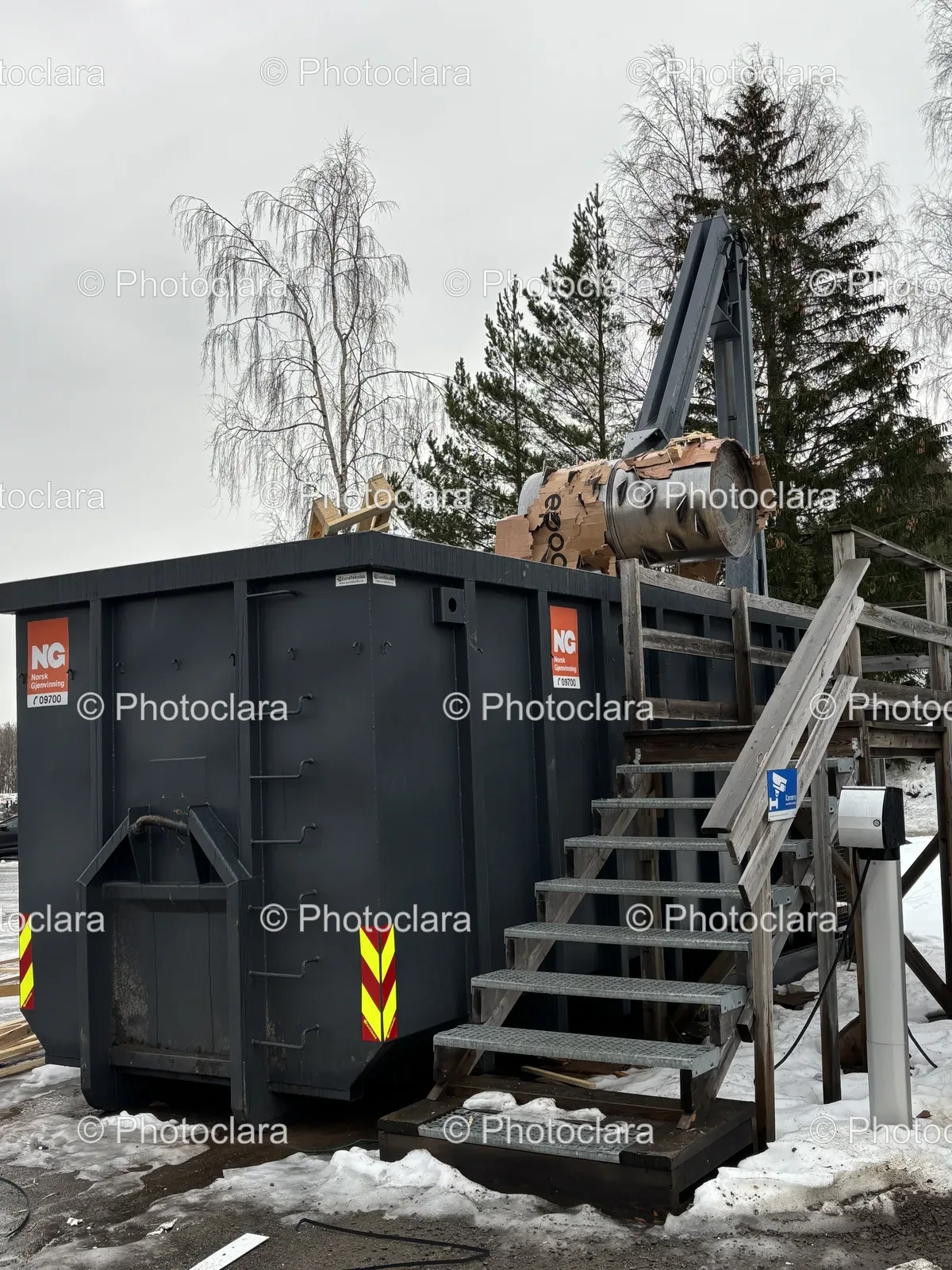 crane-on-large-metal-container-snowy-landscape.jpg
