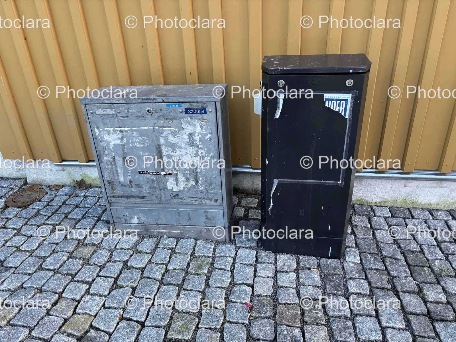 Industrial-Metal-Waste-Containers-on-Brick-Surface.jpg