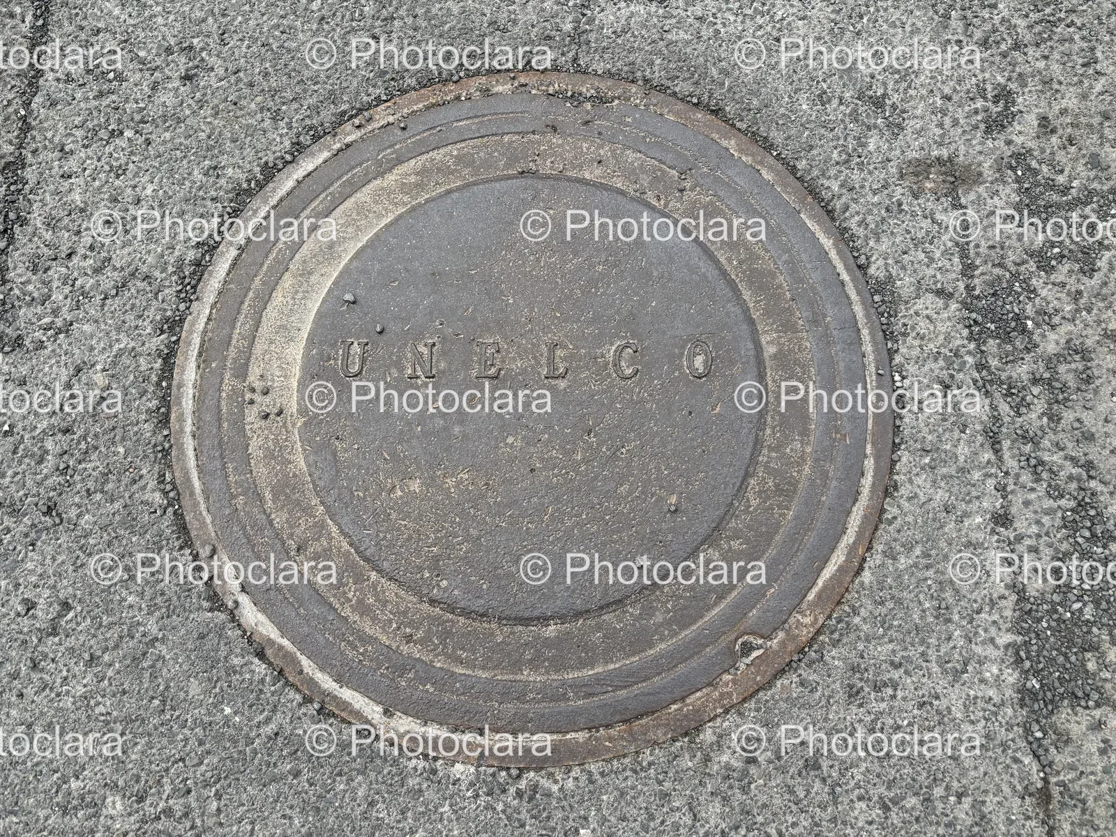 Metal-Manhole-Cover-Concrete-Ground.jpg
