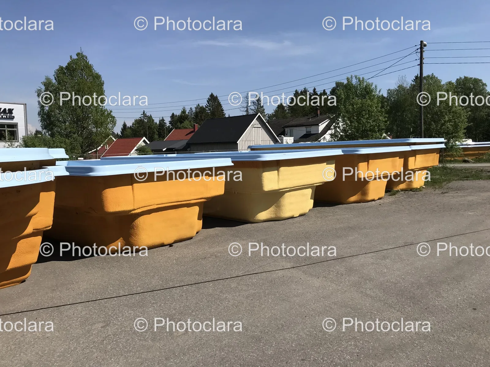 row-of-yellow-and-blue-shipping-containers-outdoors.jpg