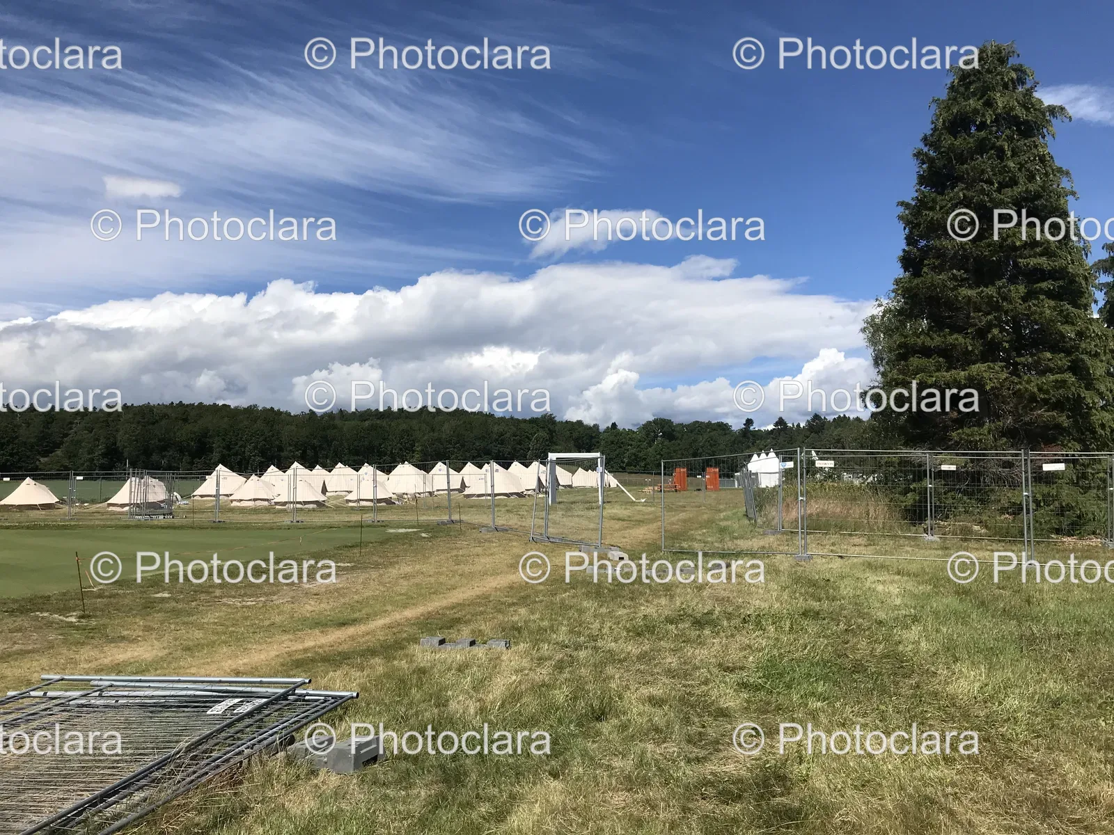 field-with-fence-and-tents.jpg