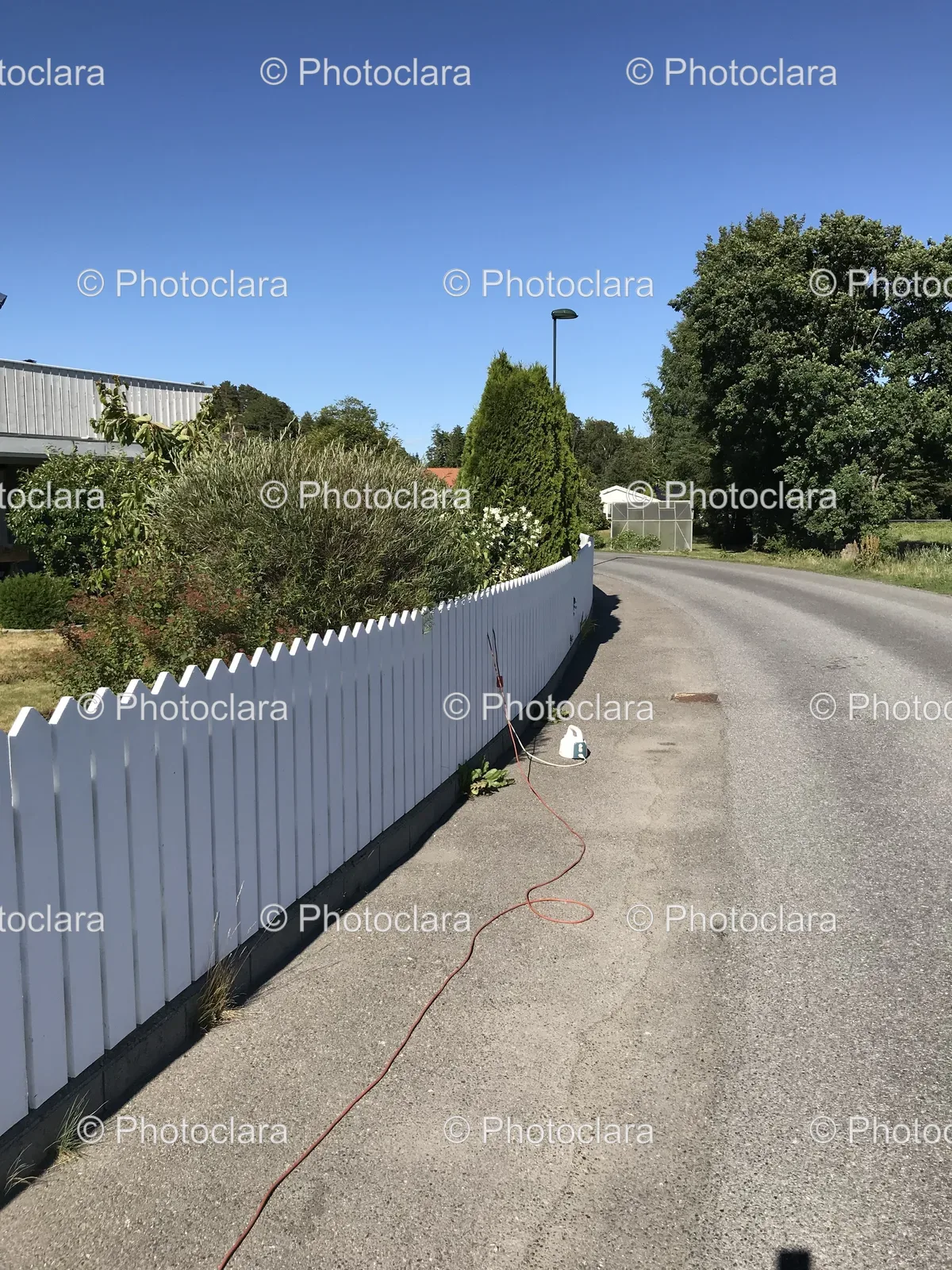 White-Fence-Next-to-Road.jpg