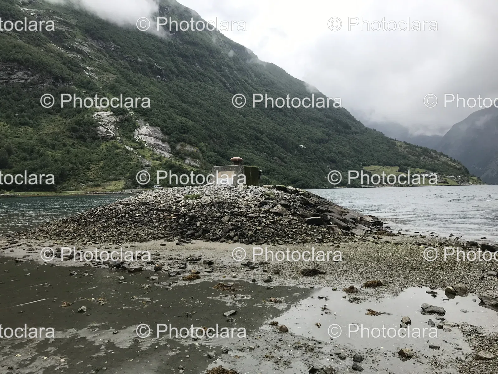 rocky-beach-with-mountain-in-the-background.jpg