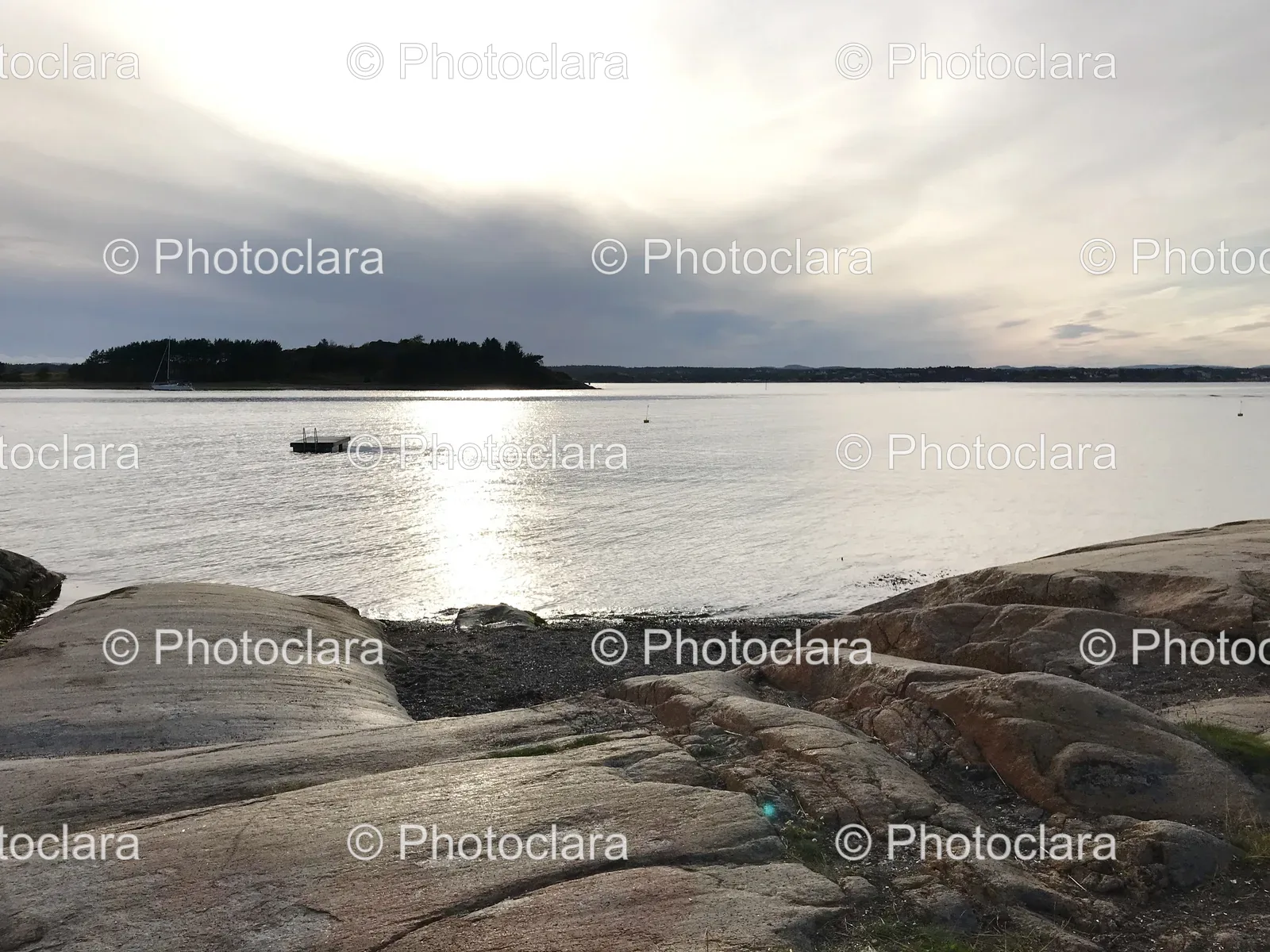 Rocky-Shore-with-a-Boat-in-the-Water.jpg