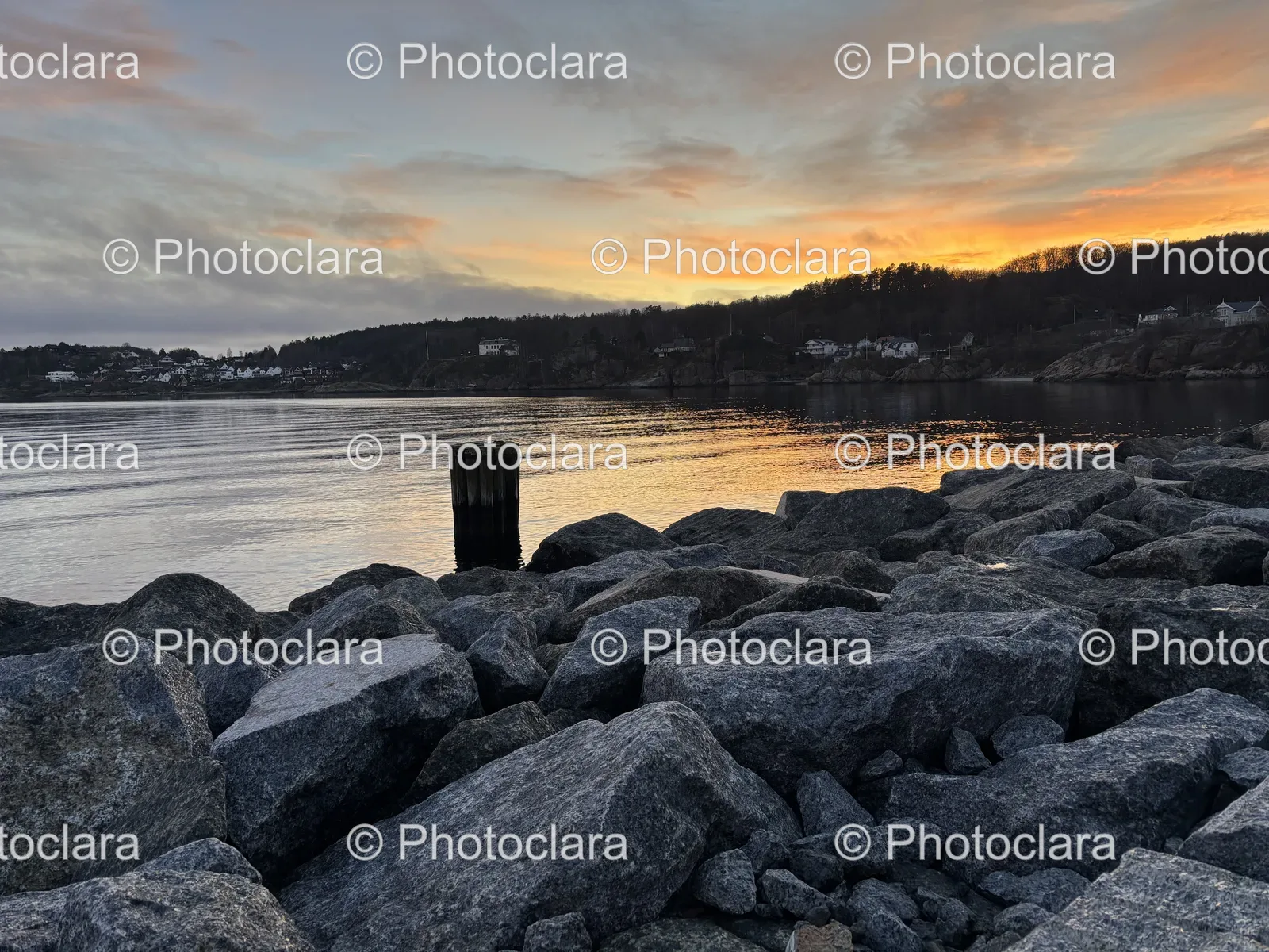 sunset-over-rocky-shoreline.jpg