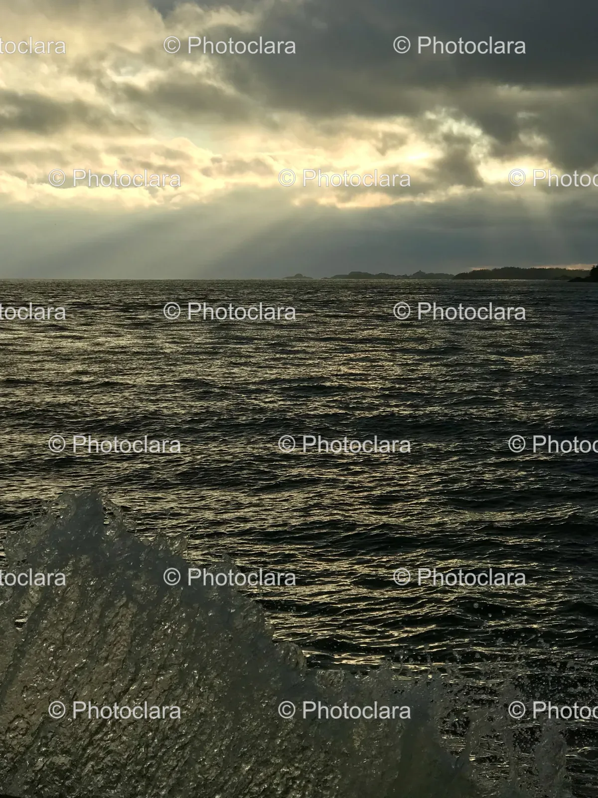 sun-rays-through-clouds-over-water.jpg