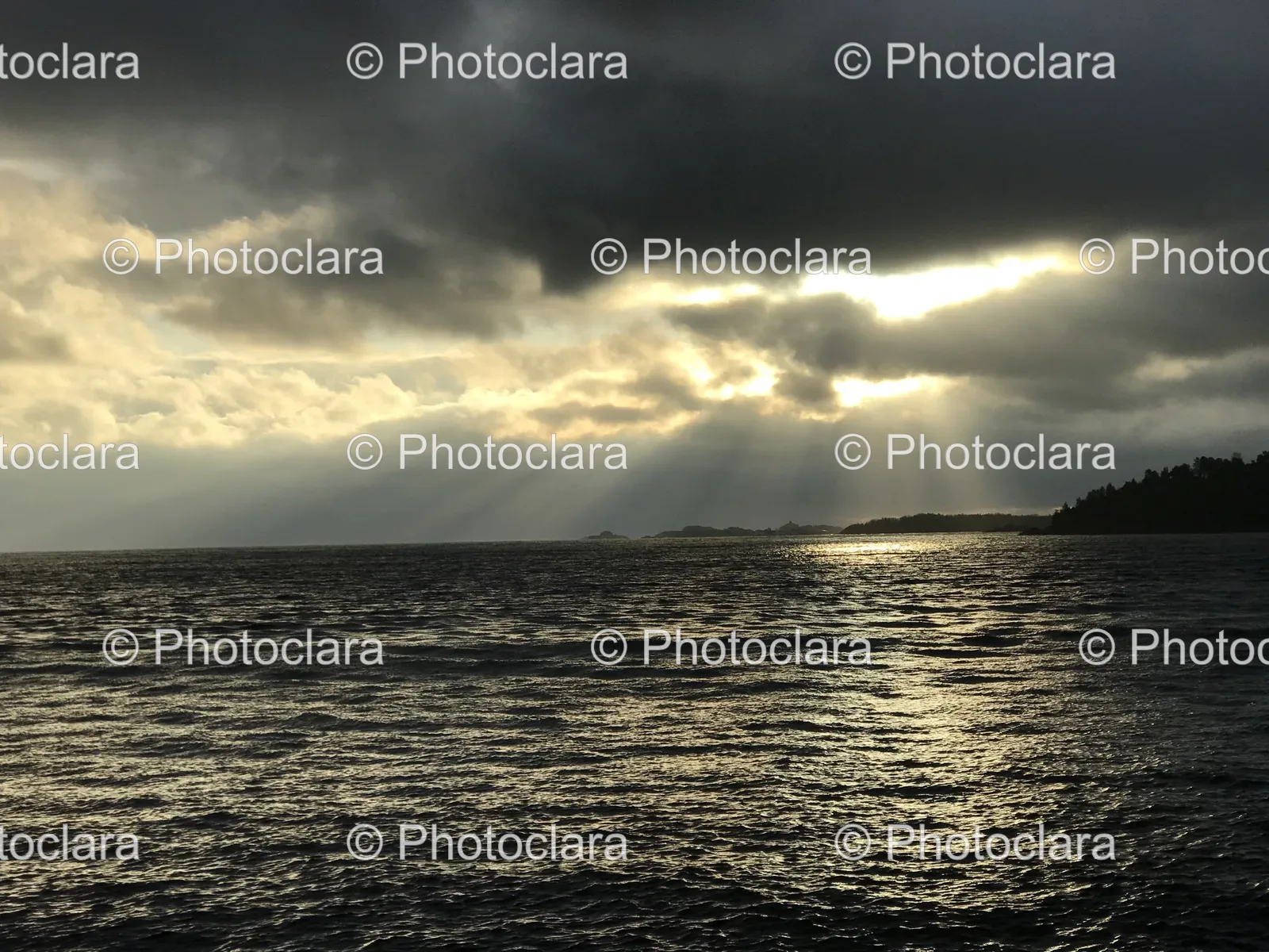 Sun-Shining-Through-Clouds-Over-Water.jpg