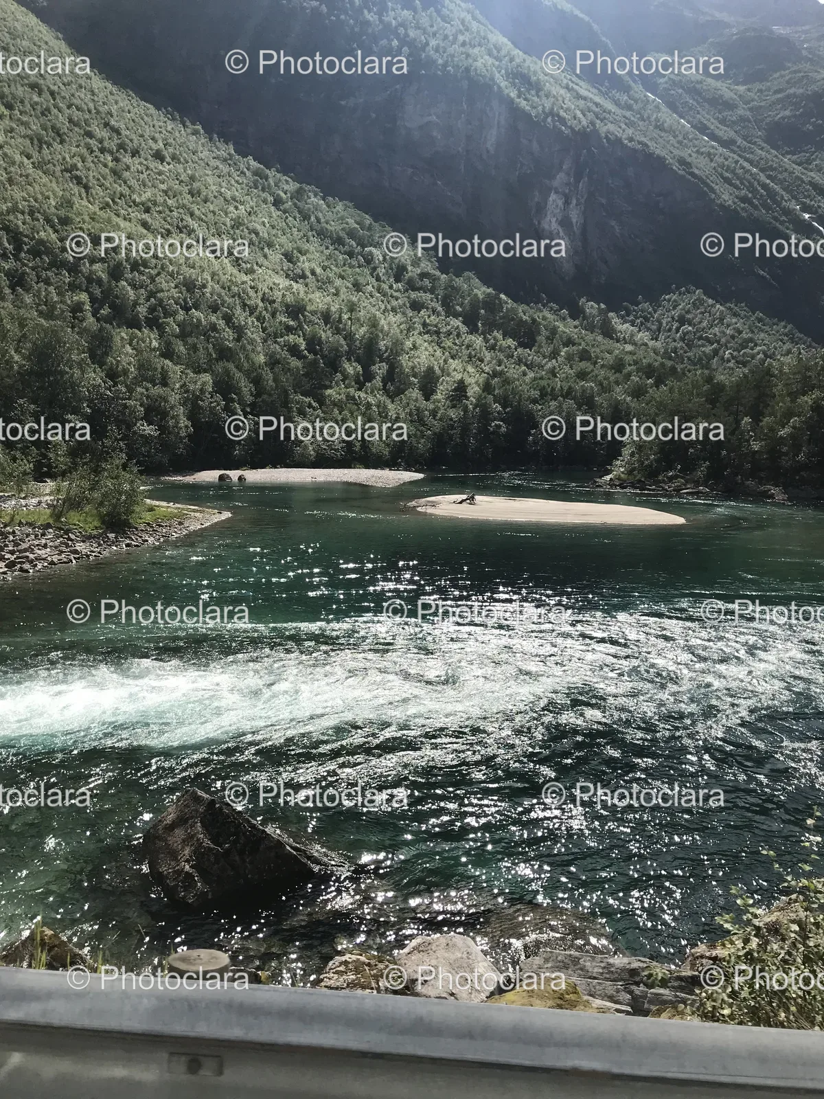 Tranquil-River-with-Rocky-Shores.jpg