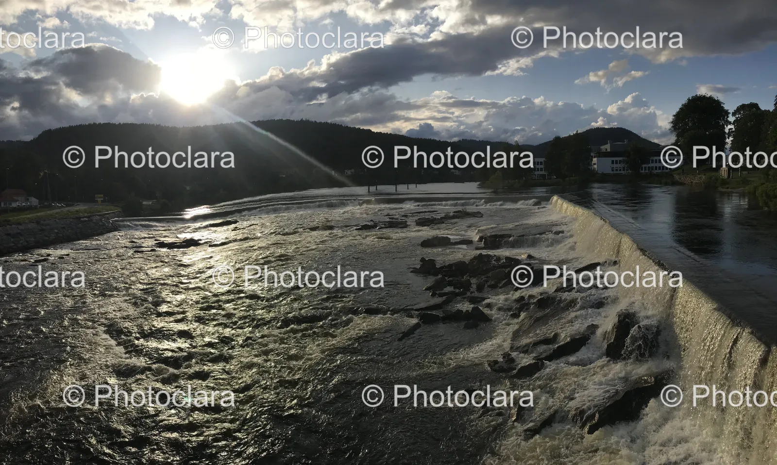 River-With-Waterfall-And-Building.jpg