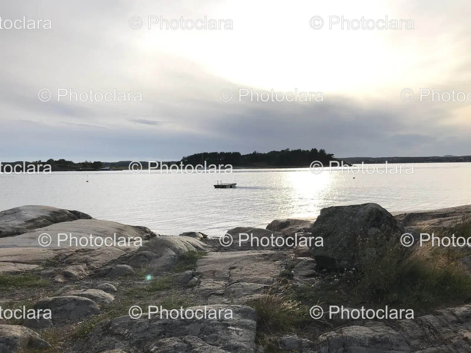 scenic-view-of-rocks-and-boat-in-water.jpg