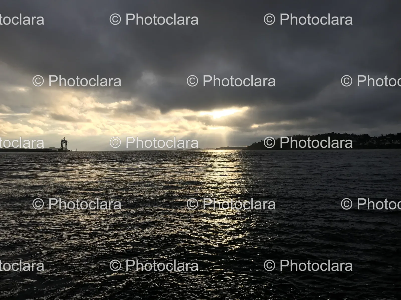 Sun-Shining-Through-Clouds-Over-Water.jpg