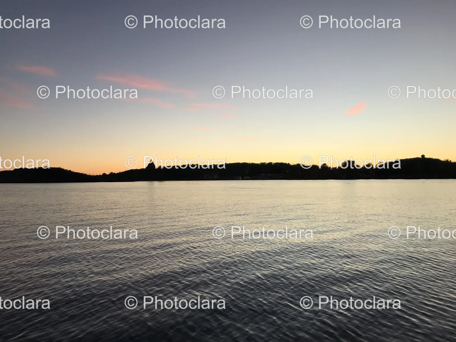 tranquil-lake-with-tree-lined-horizon.jpg