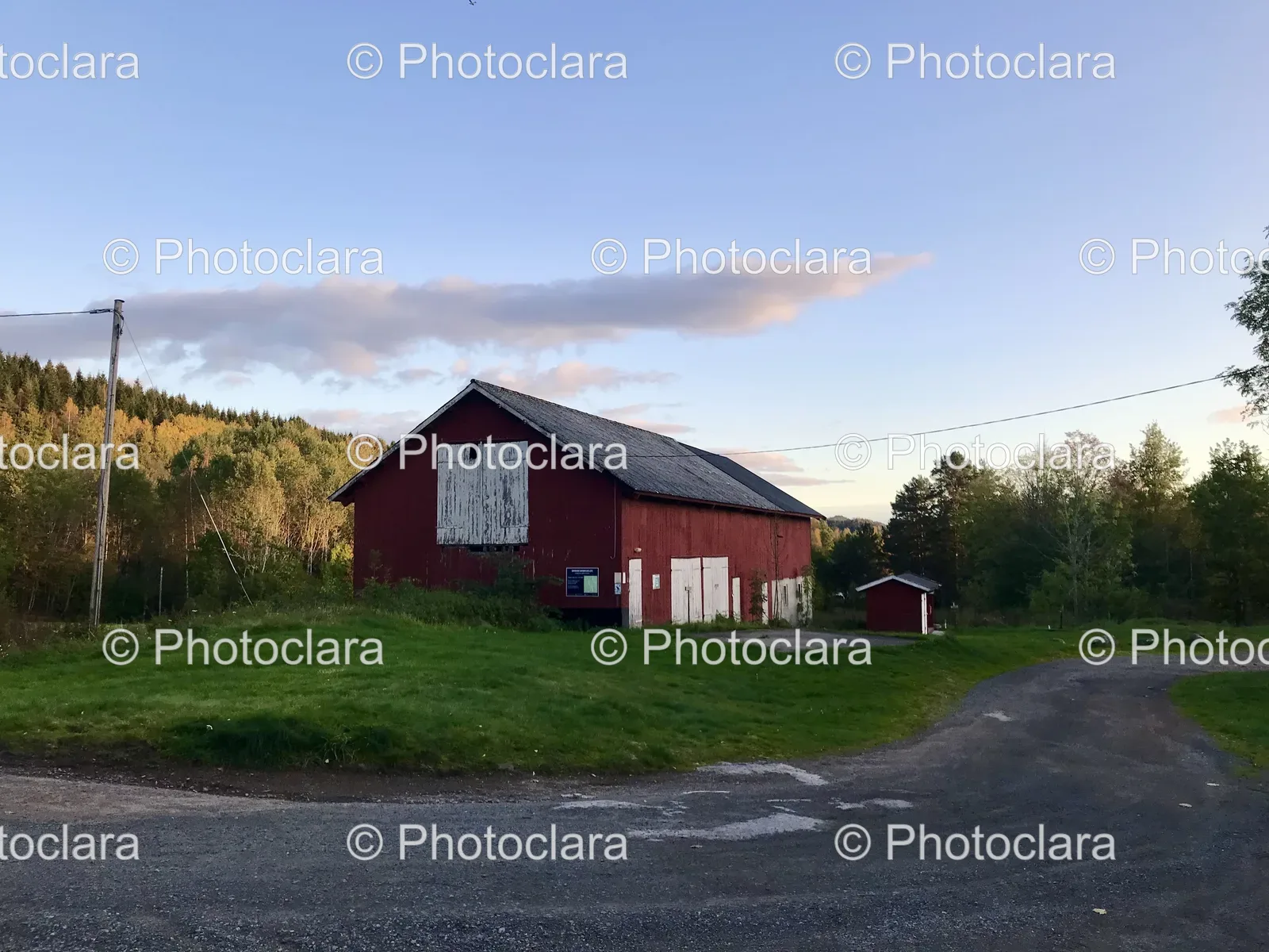 red-barn-with-road-and-trees.jpg