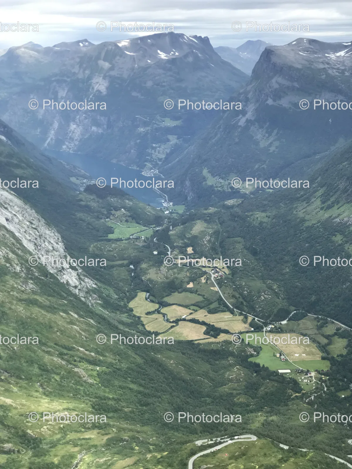 Tranquil-Valley-with-River-and-Majestic-Mountains.jpg