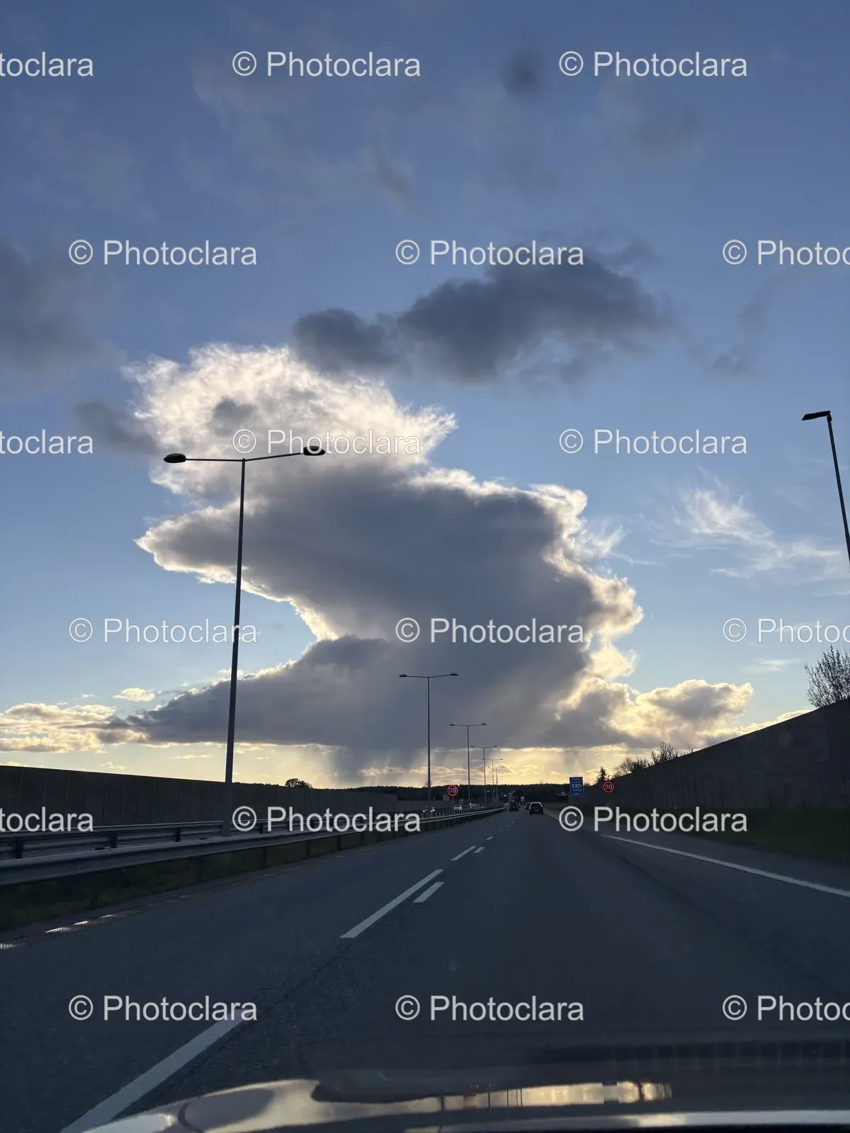 serene-road-with-street-lights-and-clouds.jpg