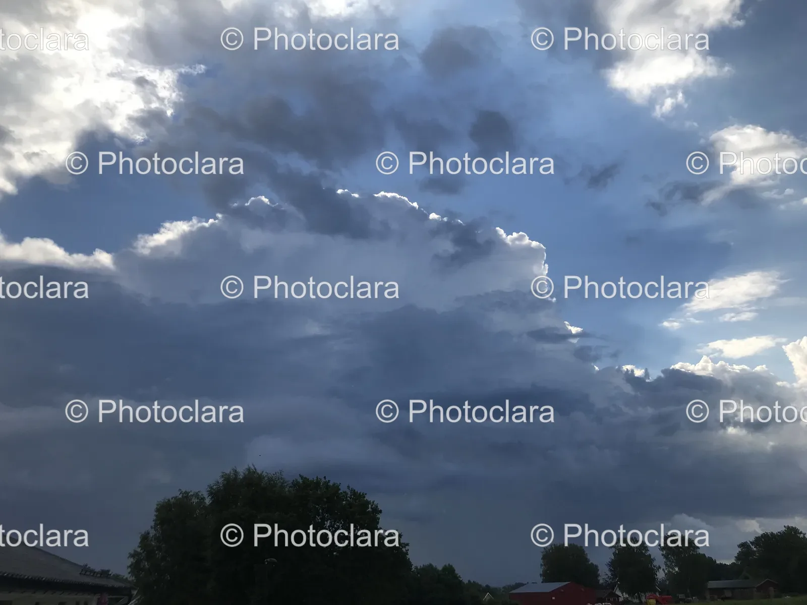 cloudy-sky-with-trees-and-buildings.jpg