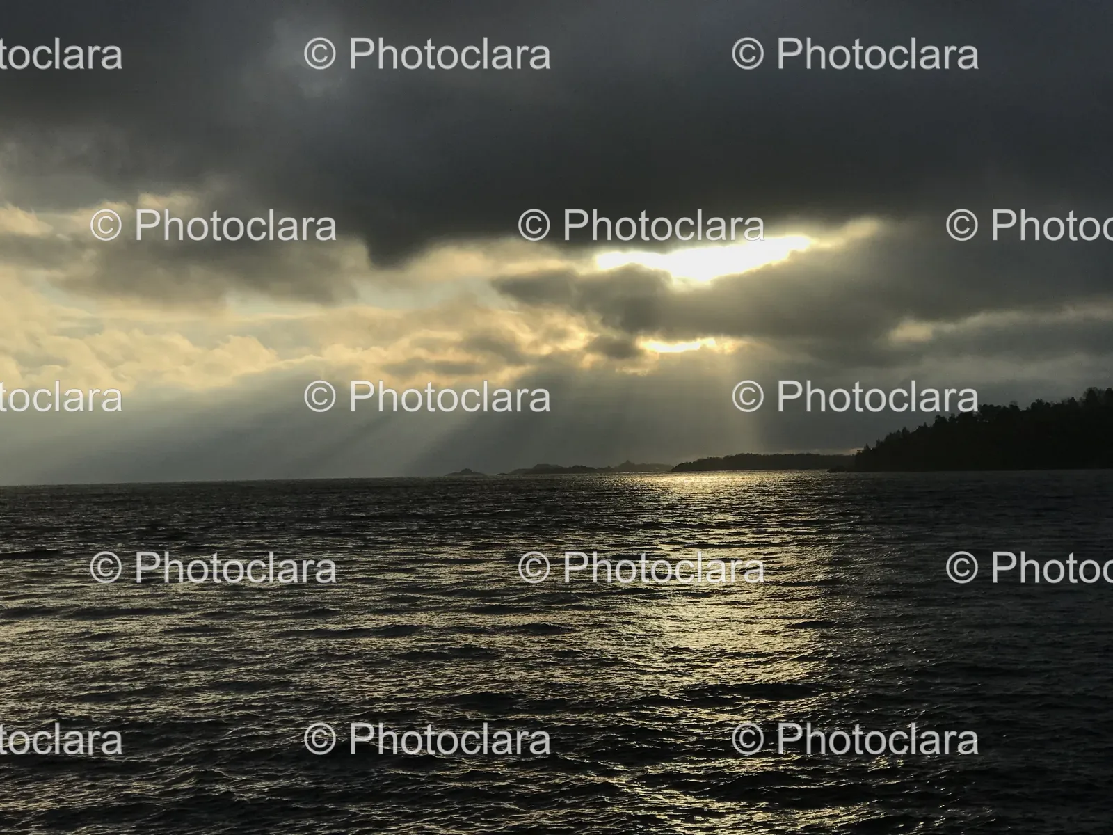 Sun-Shining-Through-Clouds-Over-Water.jpg