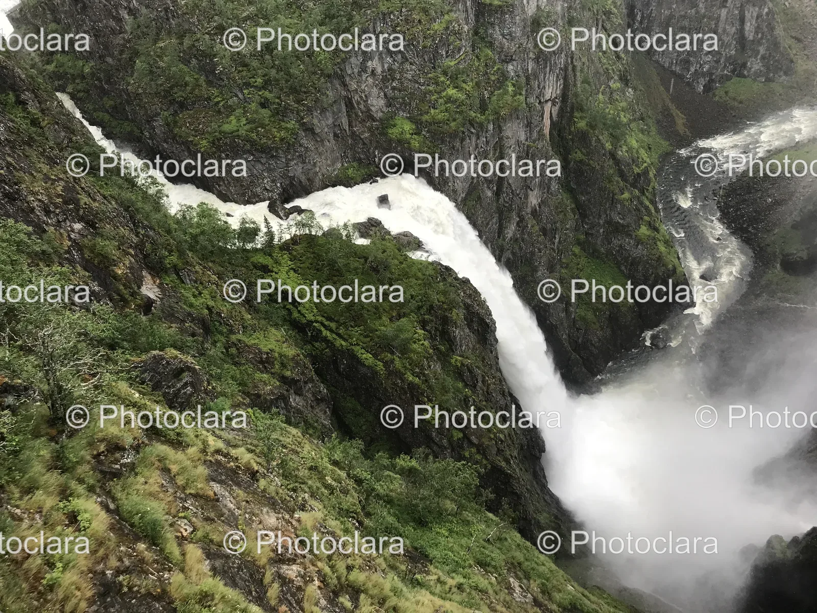 Majestic-Waterfall-Amidst-Rocky-Terrain.jpg