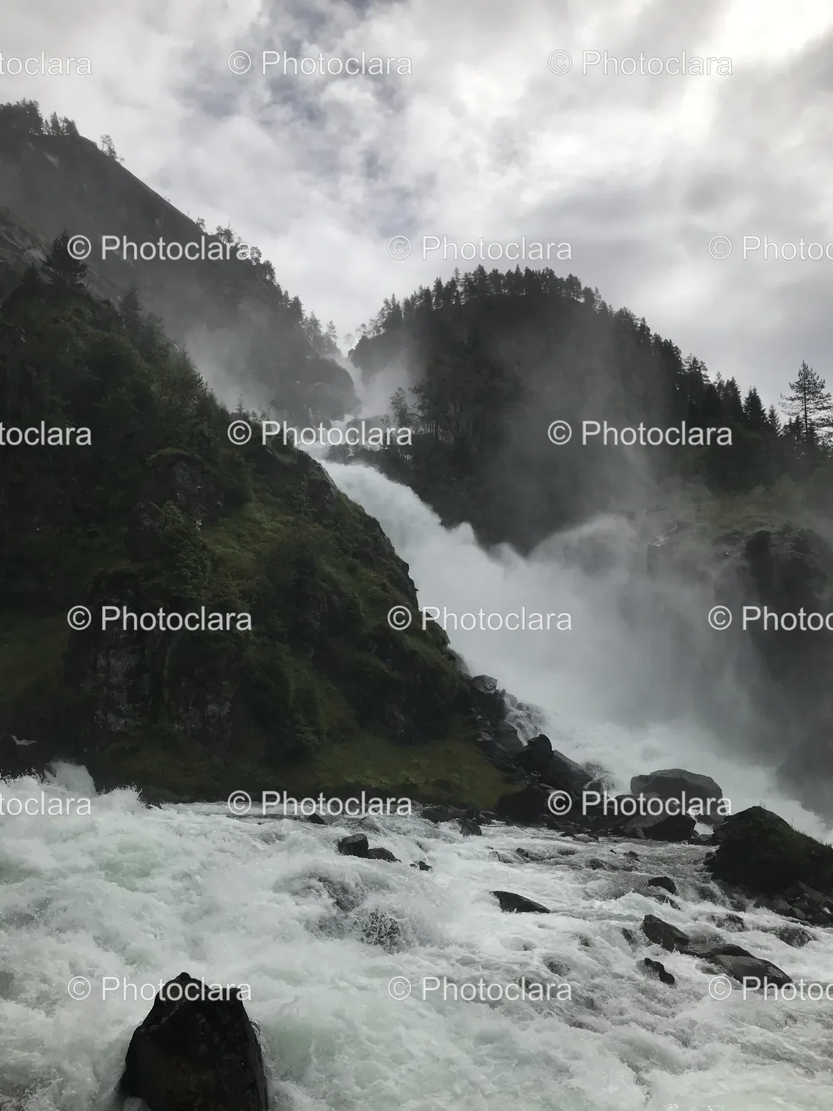 majestic-waterfall-rocky-hillside.jpg