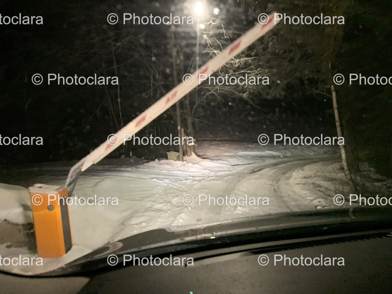 Snowy-Road-with-Barrier-at-Night.jpg