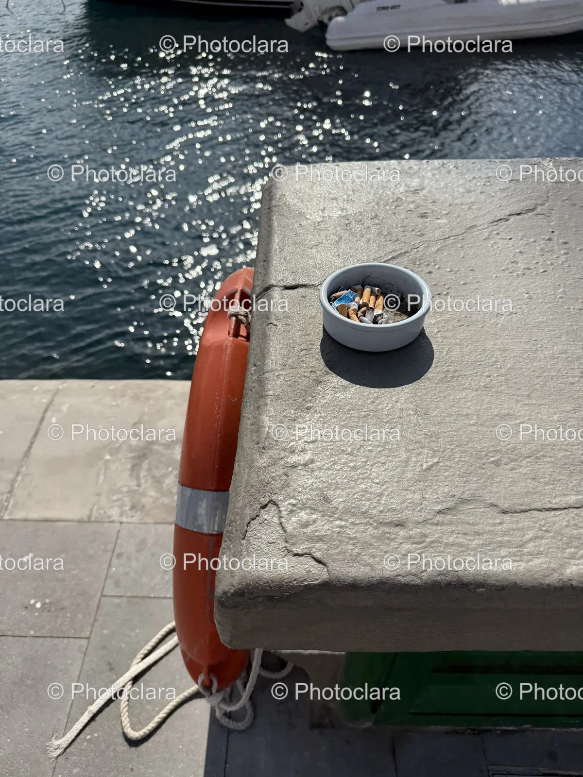 Mysterious-Bowl-of-Cigarettes-on-a-Lake-Dock.jpg