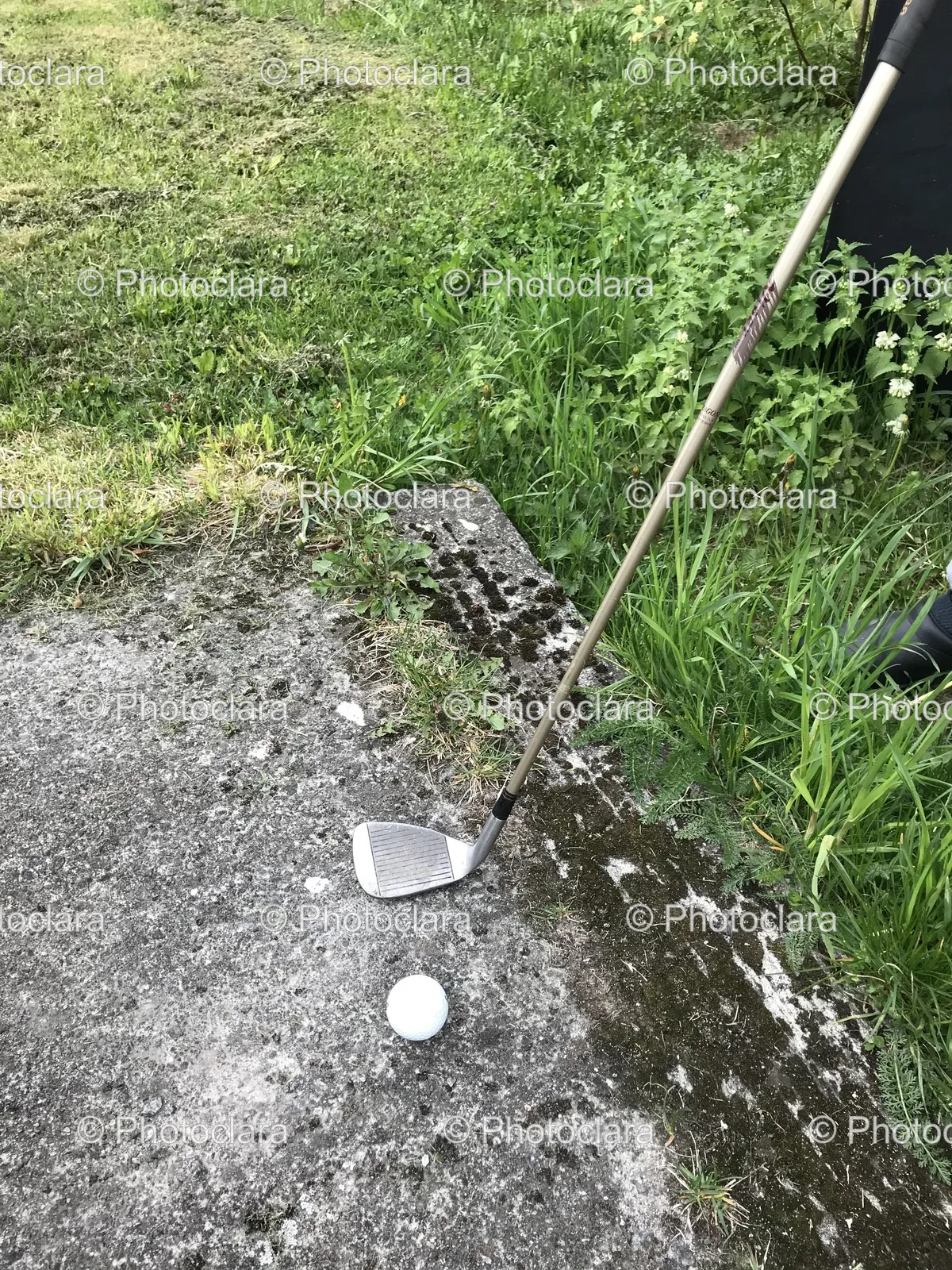 Golf-Club-and-Ball-on-Concrete-Surface.jpg