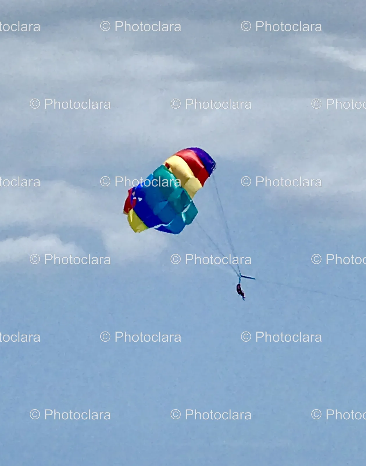 person-parachuting-blue-sky.jpg