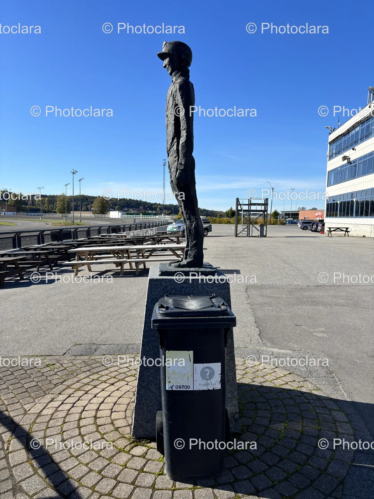 Person-Statue-on-Stone-Pedestal-Outdoors.jpg