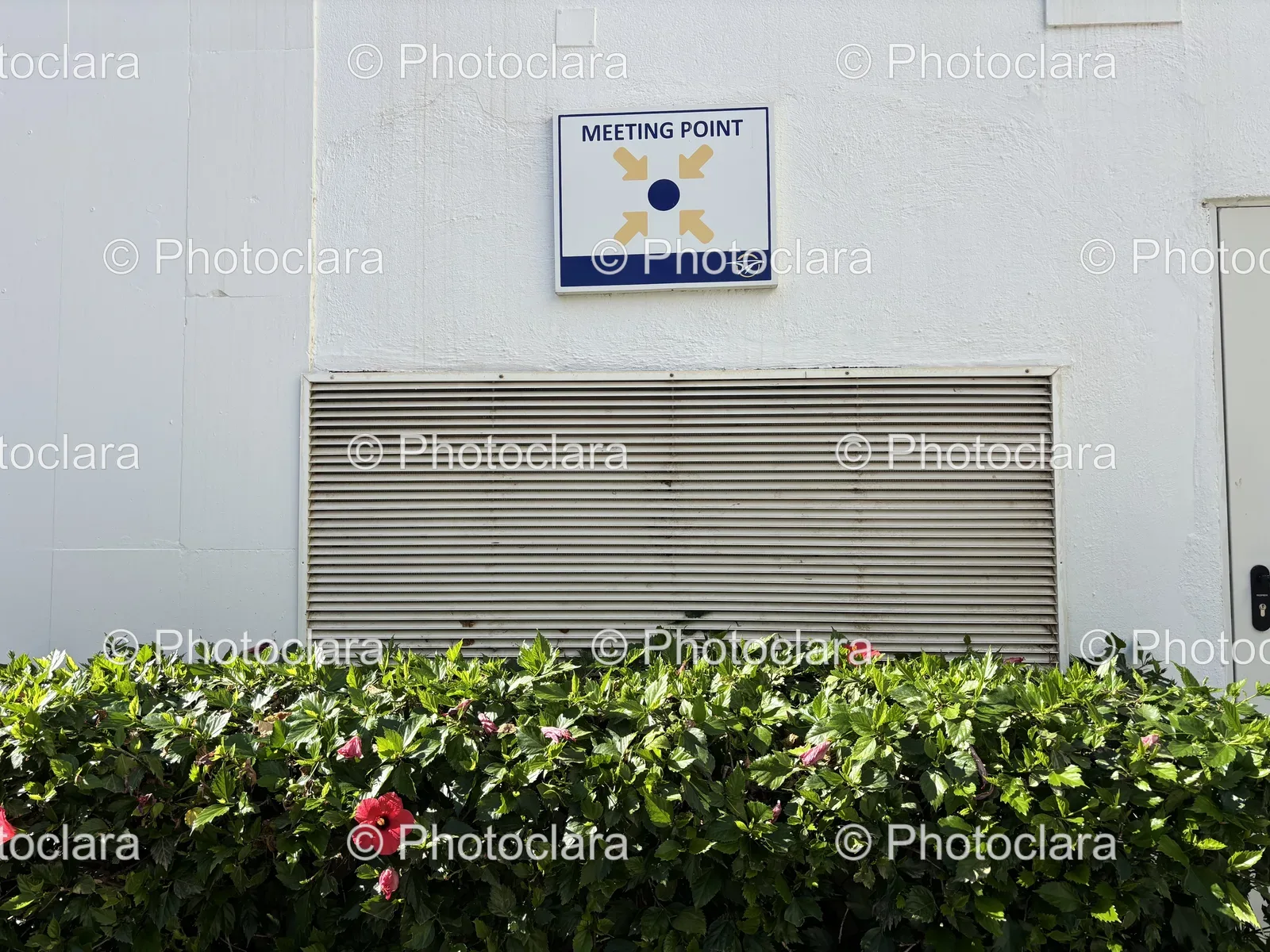 Meeting-Point-Sign-Building-Wall.jpg