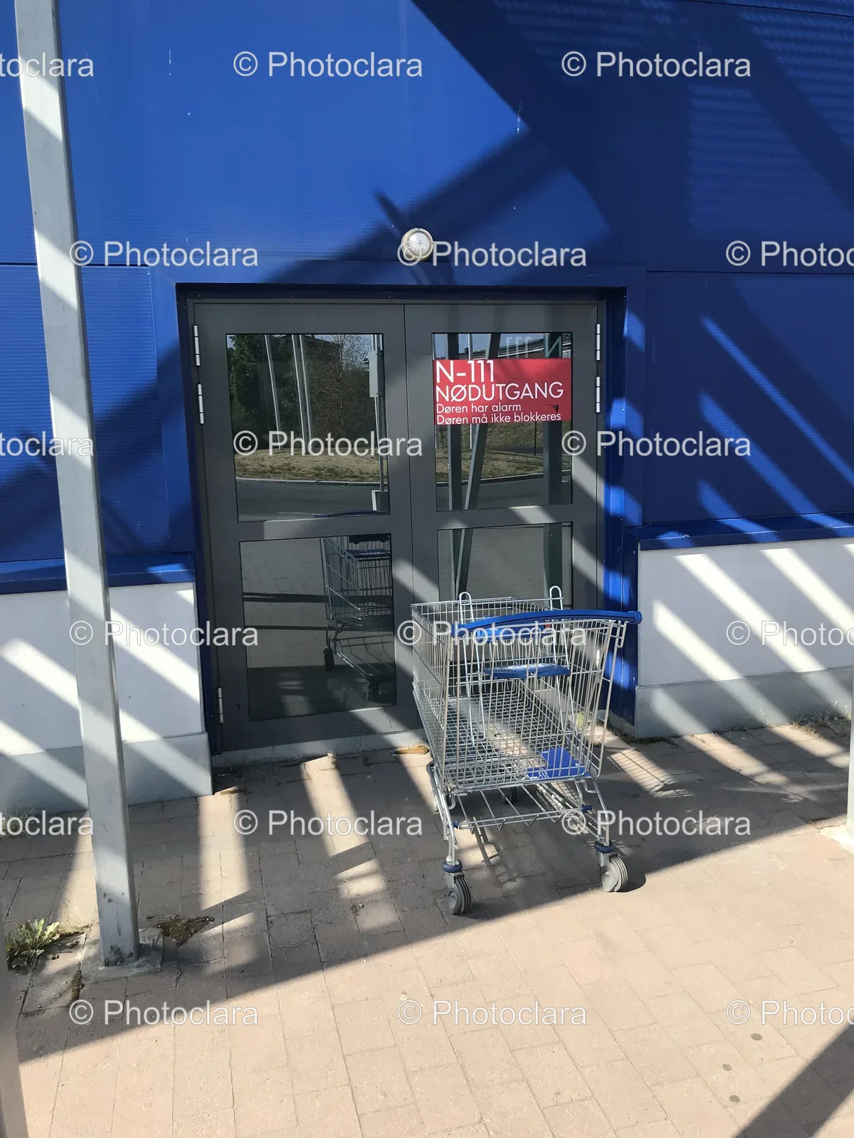 Shopping-Cart-Outside-Store-Emergency-Exit-Signs.jpg
