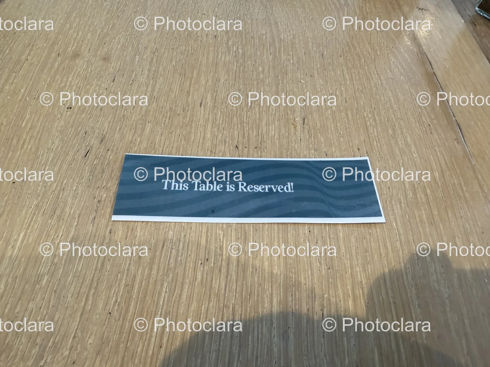 Reserved-Table-Sign-Wooden-Surface.jpg