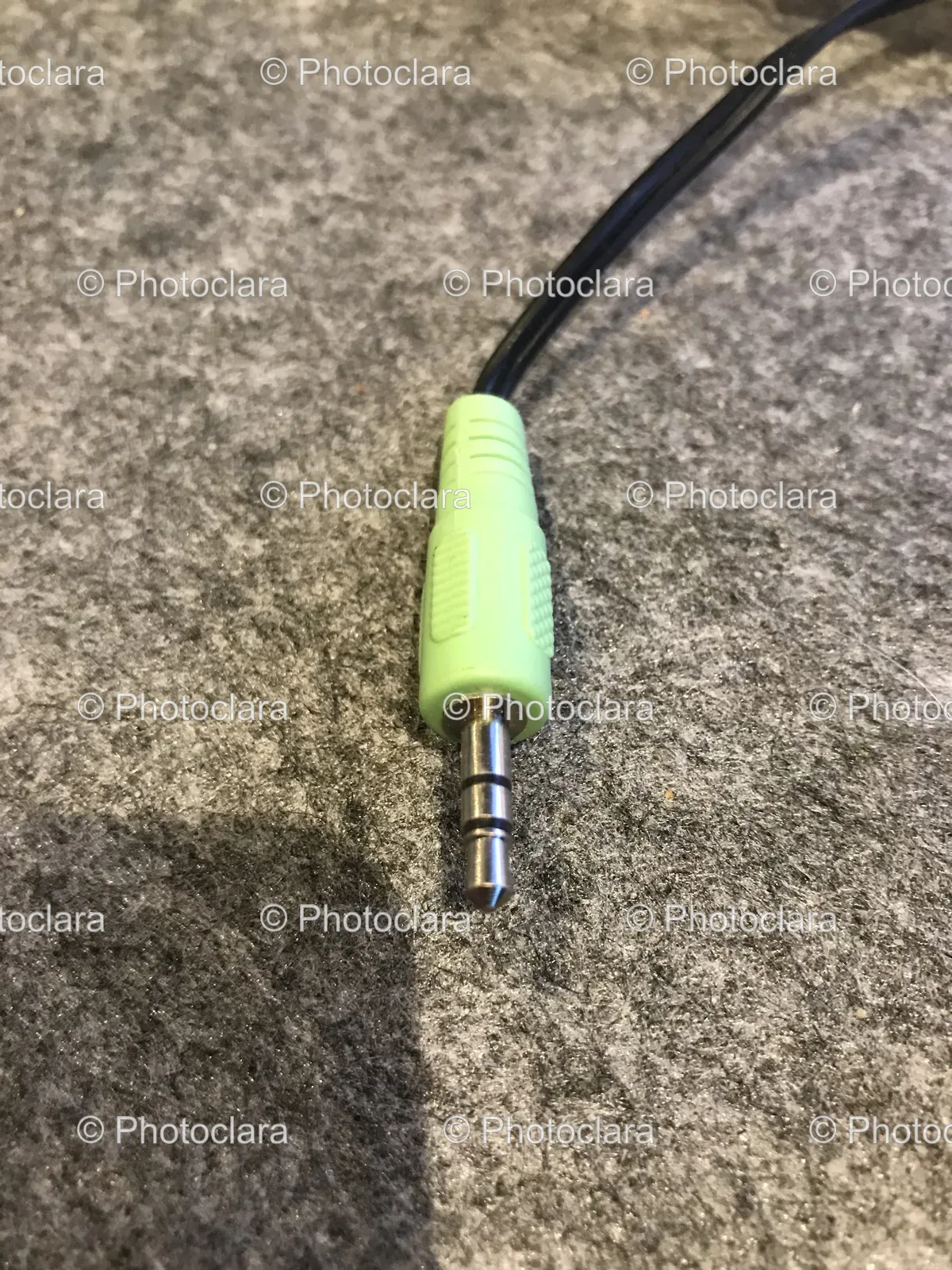 Green-Audio-Cable-On-Grey-Surface.jpg