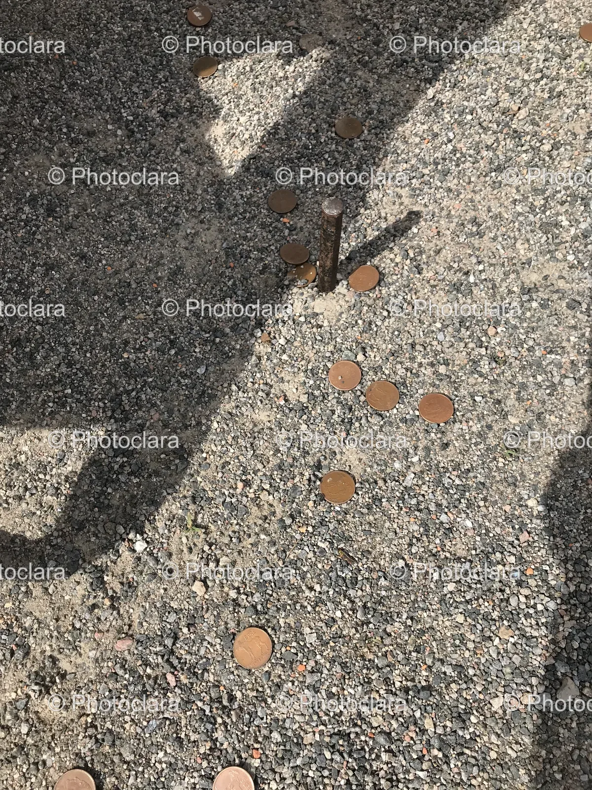 Coins-Embedded-in-Pavement.jpg