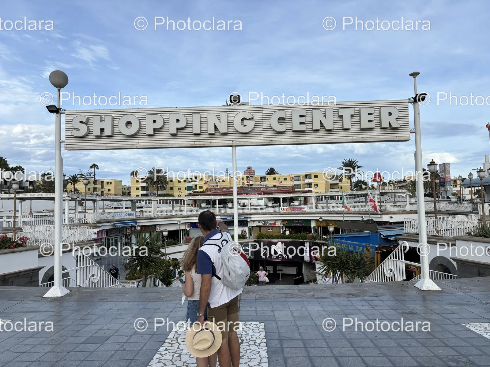 People-in-Front-of-Shopping-Center-Sign.jpg