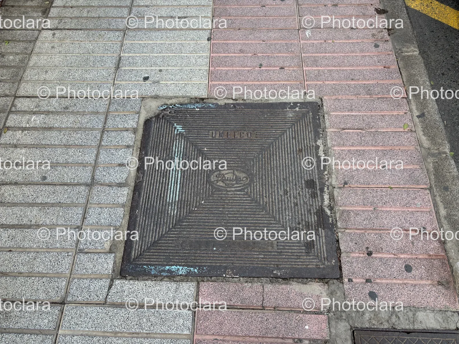 Square-Metal-Grate-on-Sidewalk.jpg