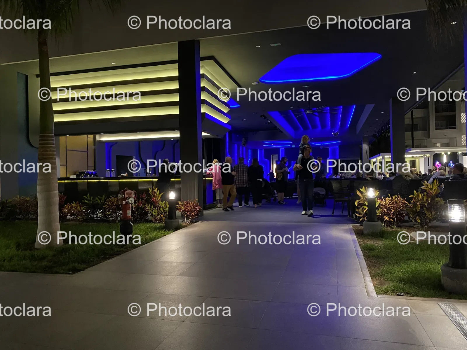 Nighttime-Walk-Near-Illuminated-Urban-Building.jpg