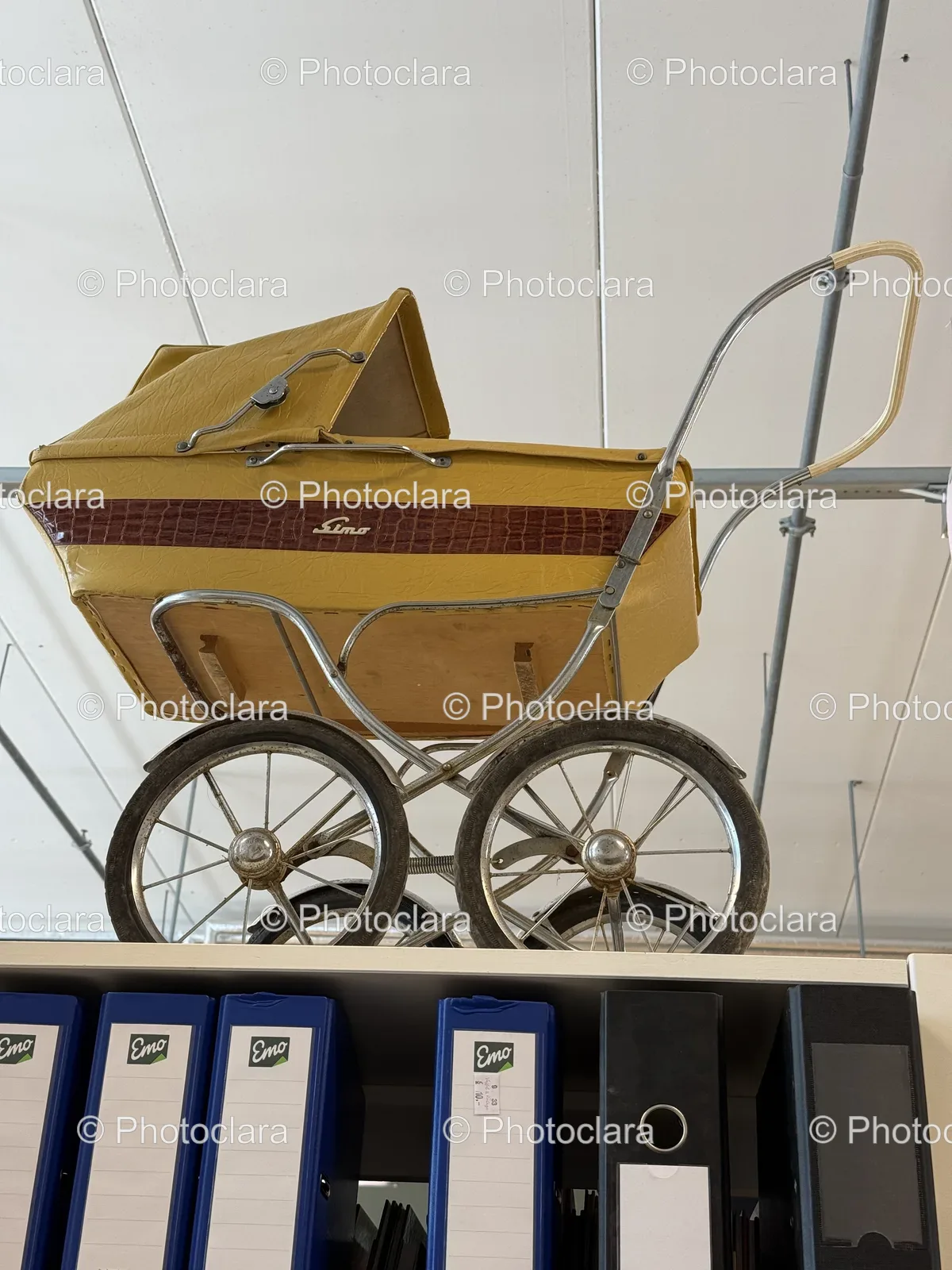 Vintage-Baby-Carriage-on-Display-Shelf.jpg