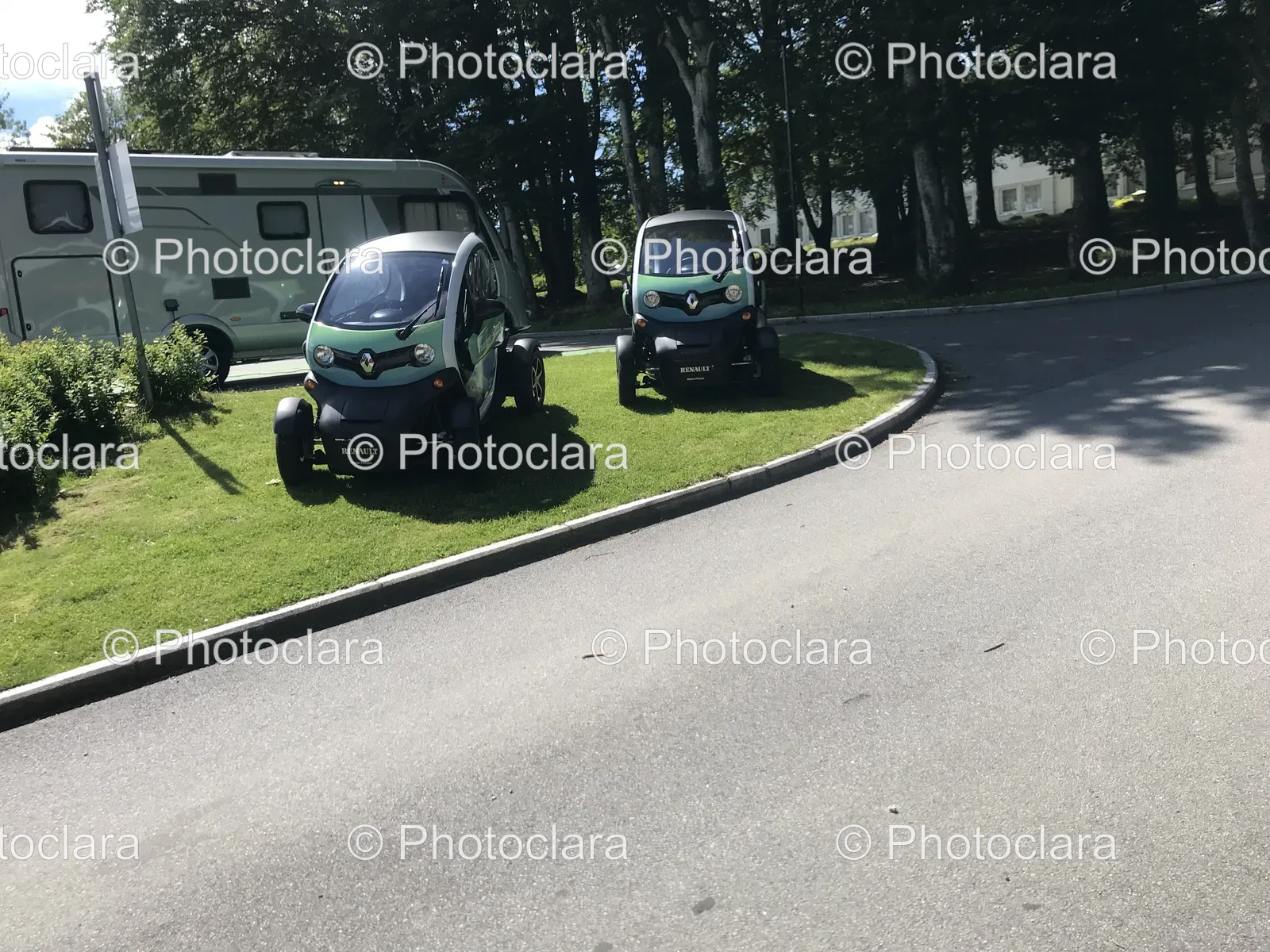 parked-cars-on-grass-near-road.jpg